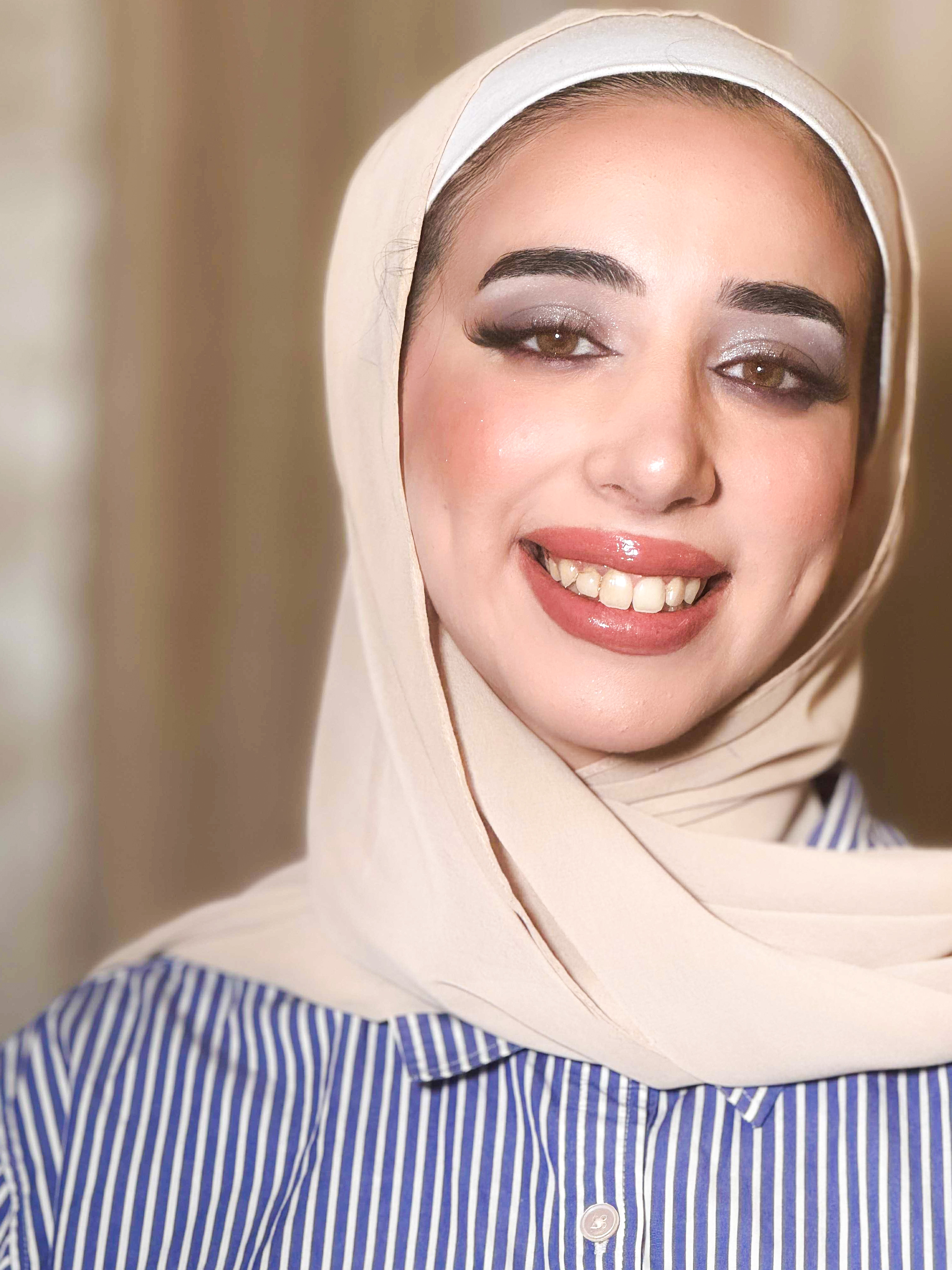 Polished makeup with defined eyes and coral lips